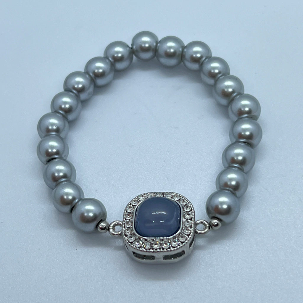 Pulsera plateada de perla elástica