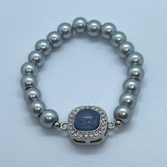 Pulsera plateada de perla elástica