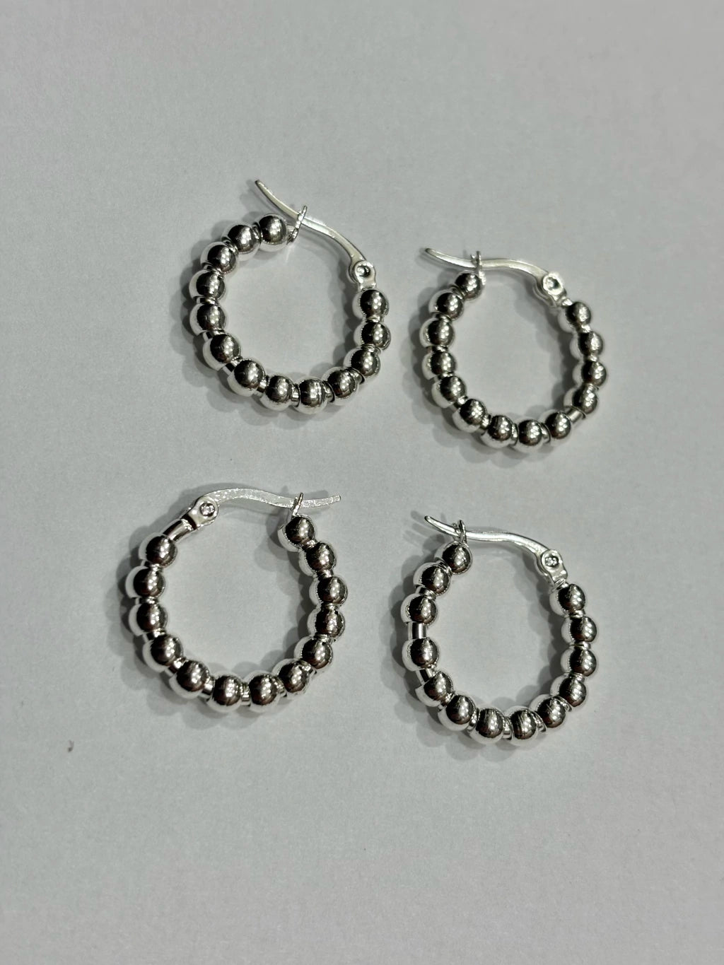-557C argollas acero blanco x12
