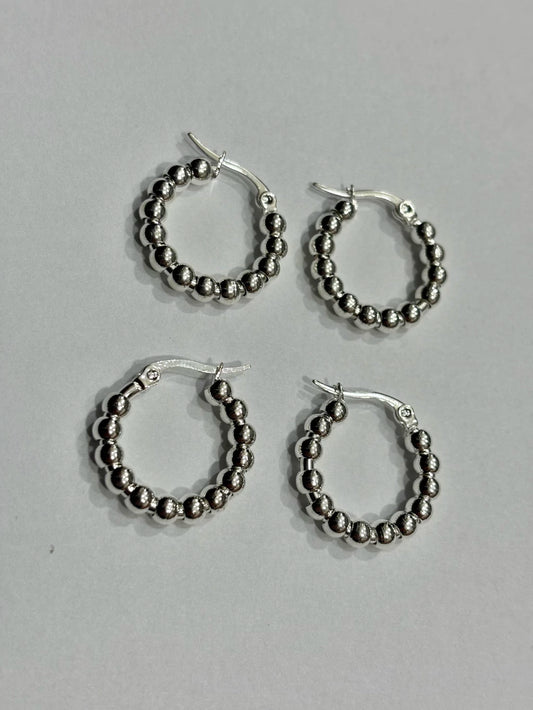 -557C argollas acero blanco x12