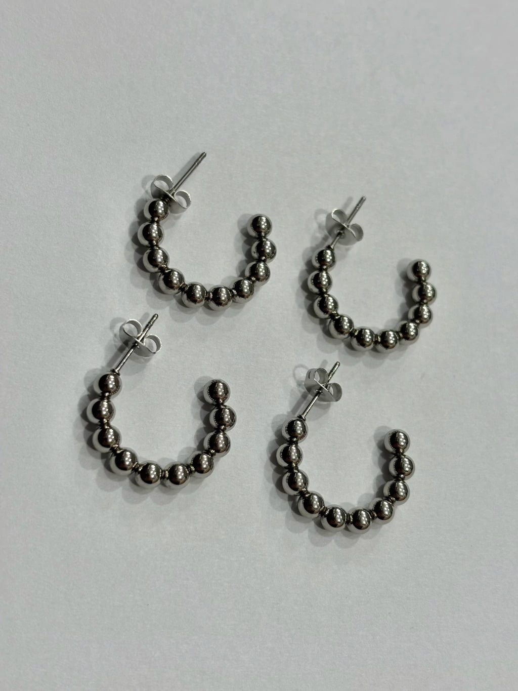 -560A argollas acero plateado x12