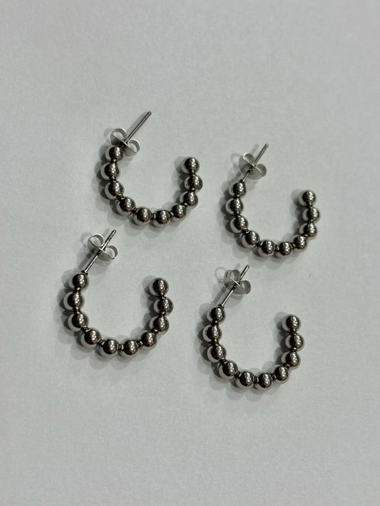 -560A argollas acero plateado x12