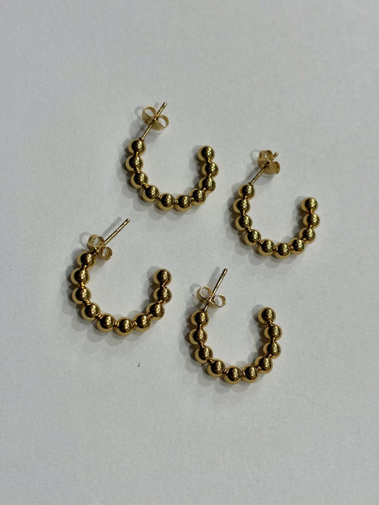 -560B argollas acero dorado x12