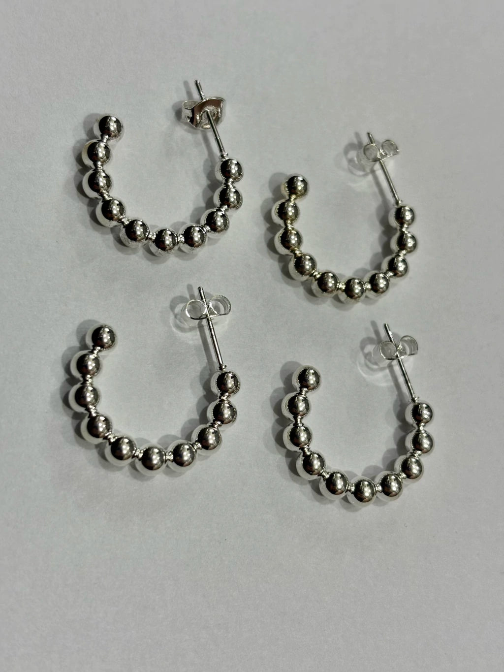 -560C argollas acero blanco x12