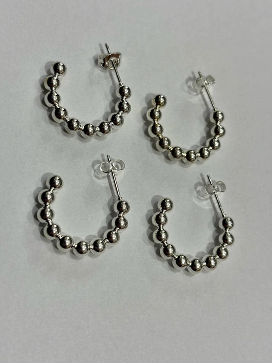 -560C argollas acero blanco x12