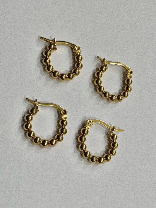 -555B argollas acero dorado x12
