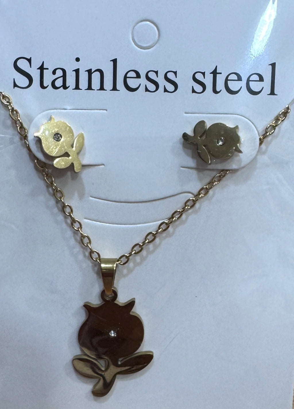 Set de aritos y collar acero dorado flor