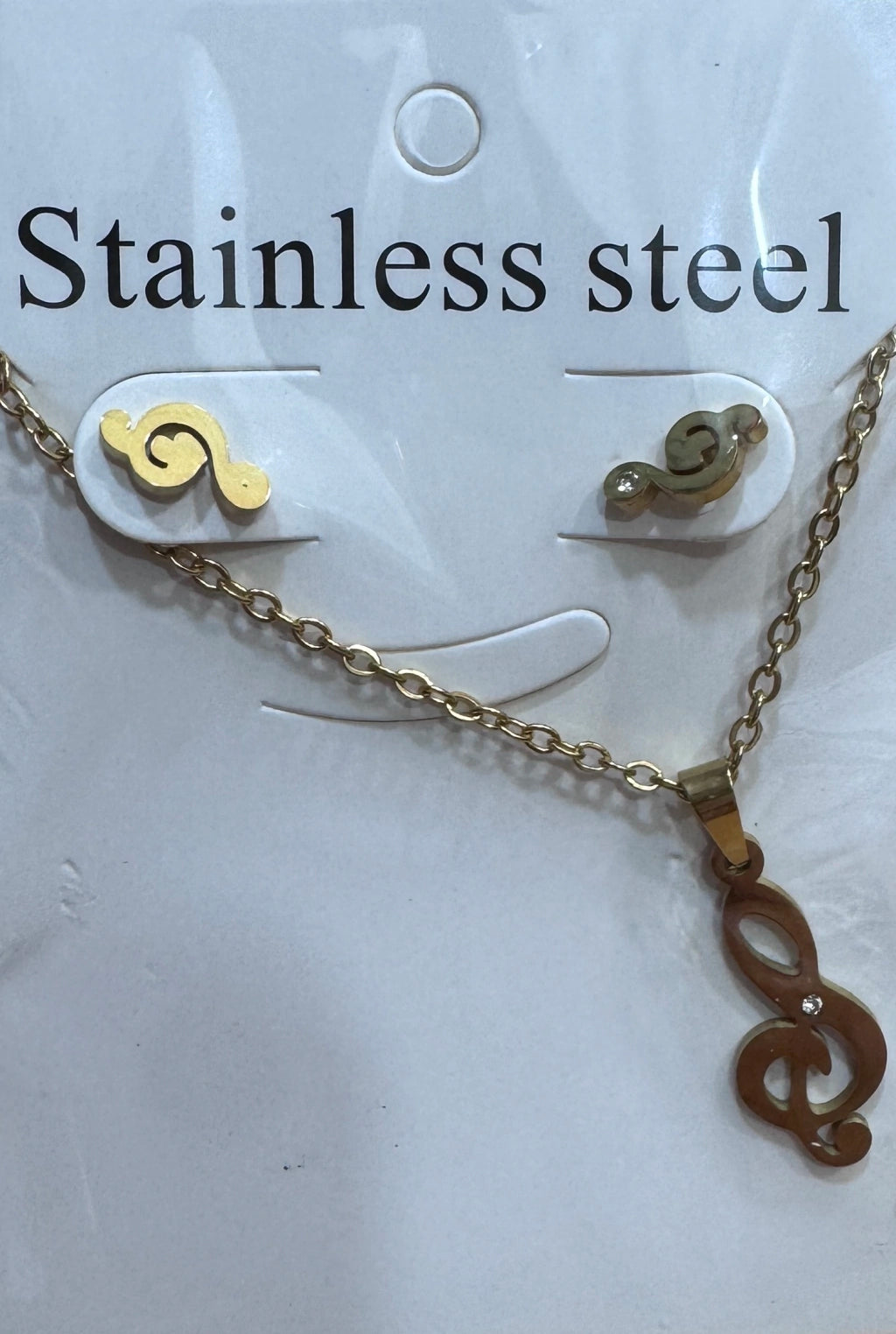 Set de aritos y collar acero dorado signo de música
