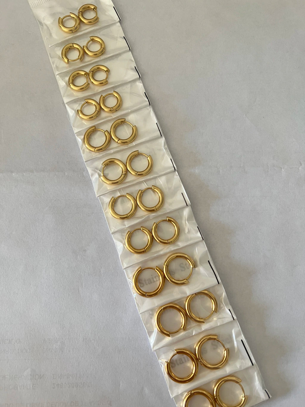 Aritos de acero dorado x12 409-4-B1