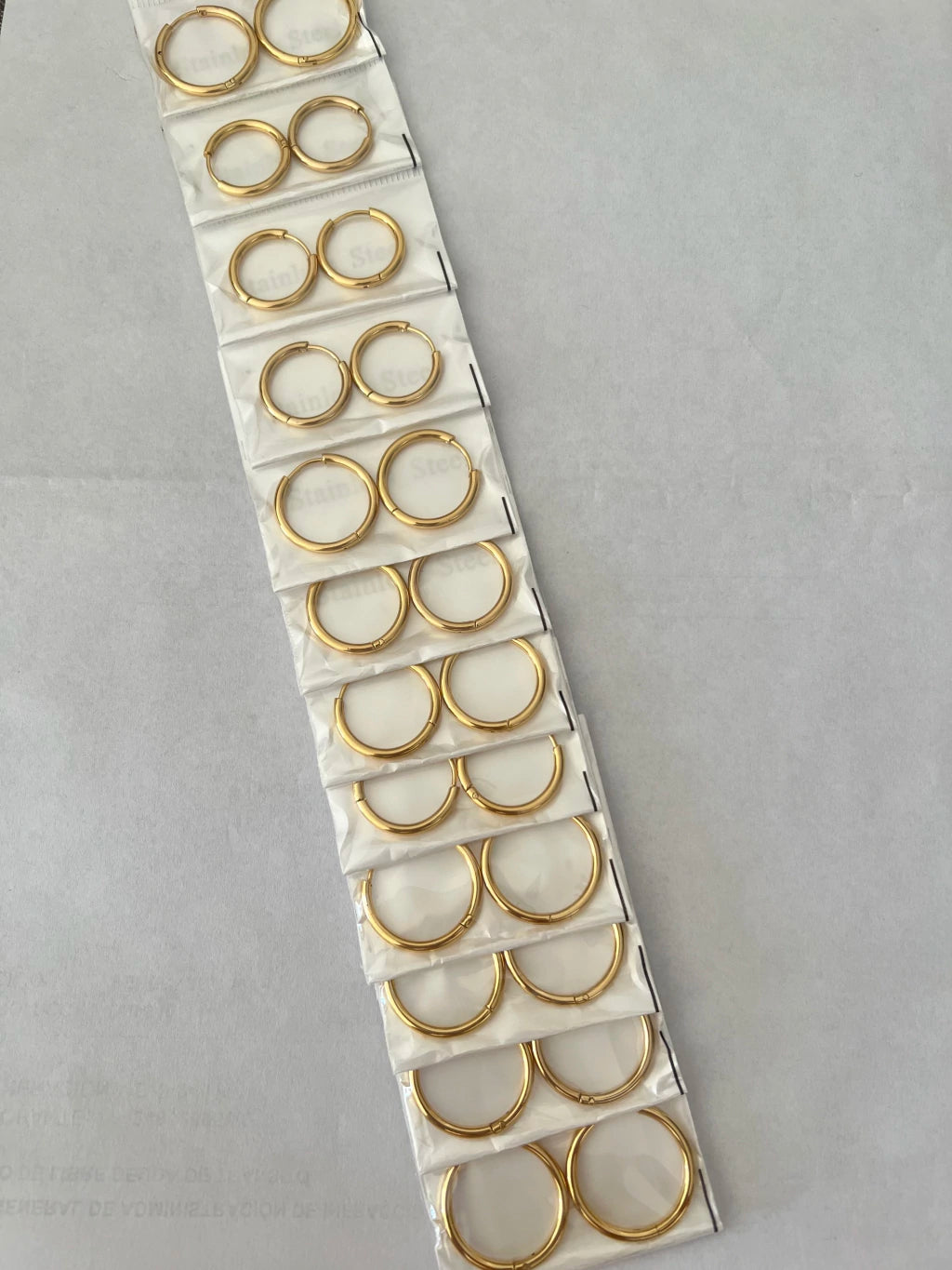 Aritos de acero dorado x12 409-2-B2