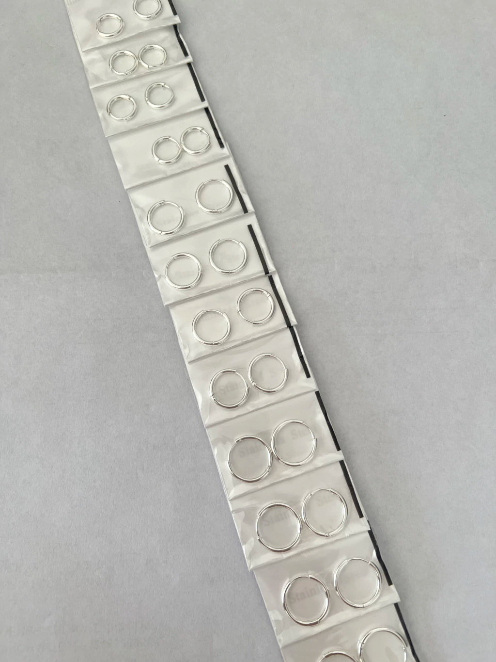 Aritos de acero blanco x12 409-1-C1