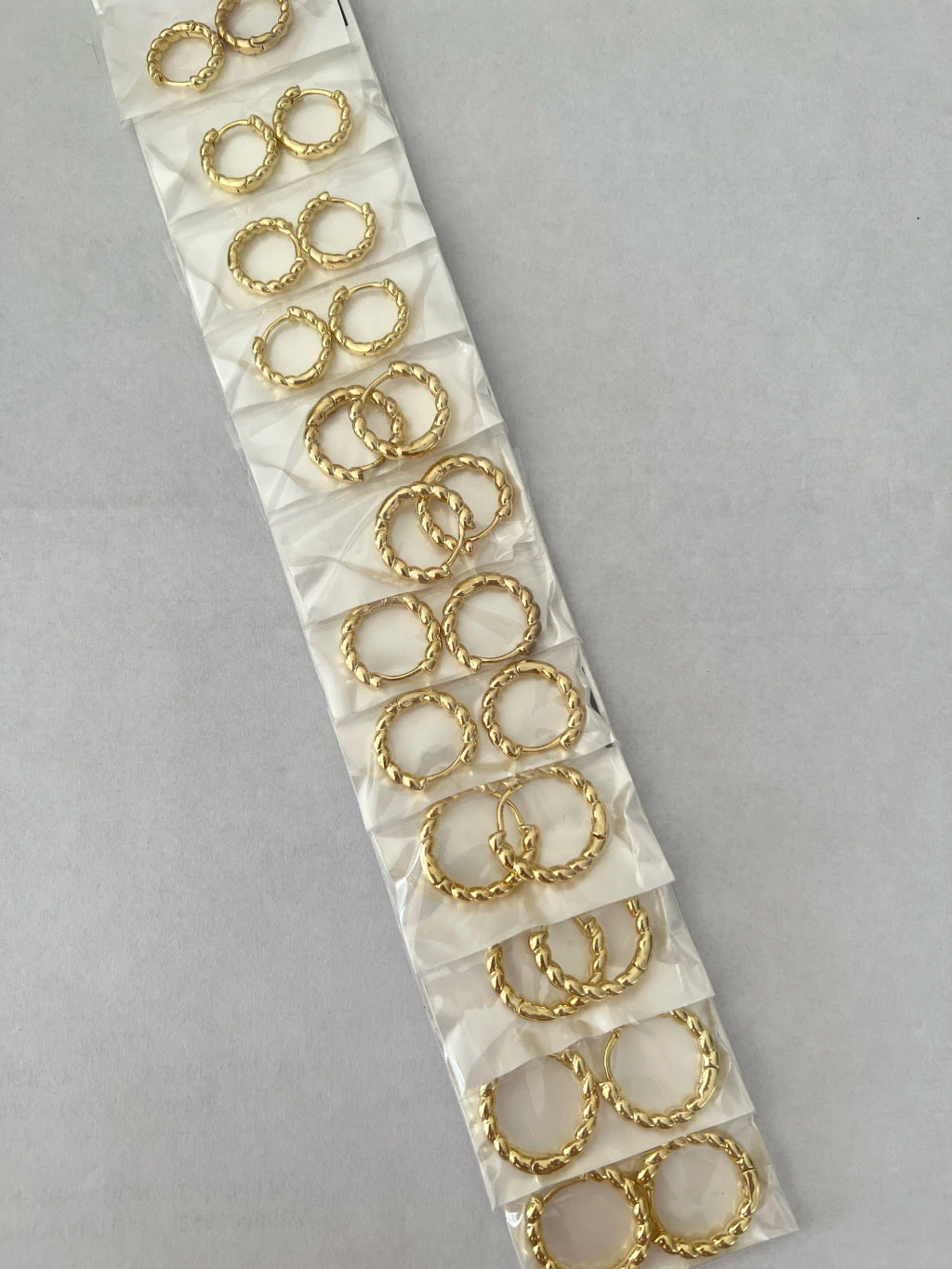Aritos de acero dorado x12 663-B