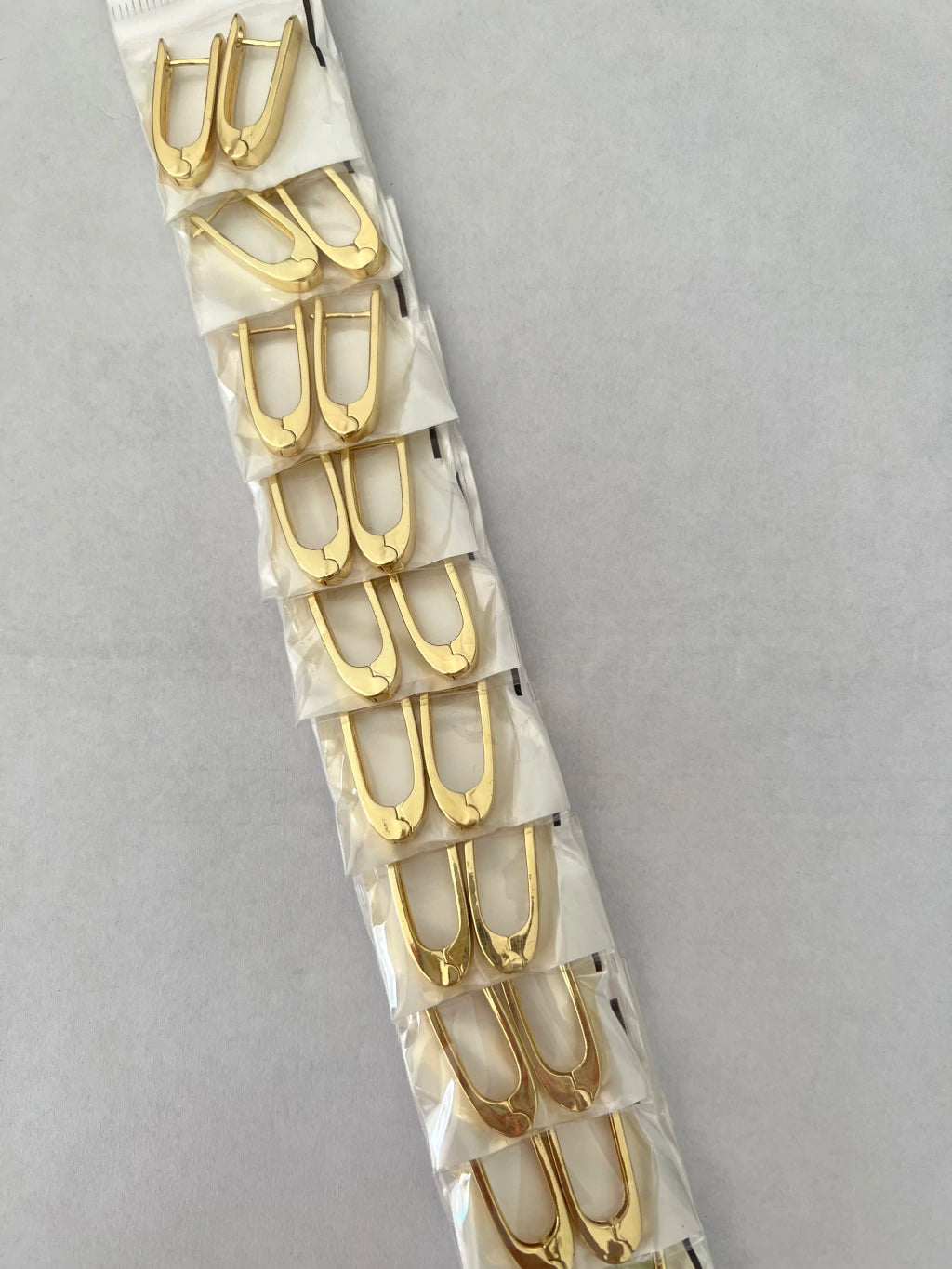 Aritos de acero dorado x12 651-B