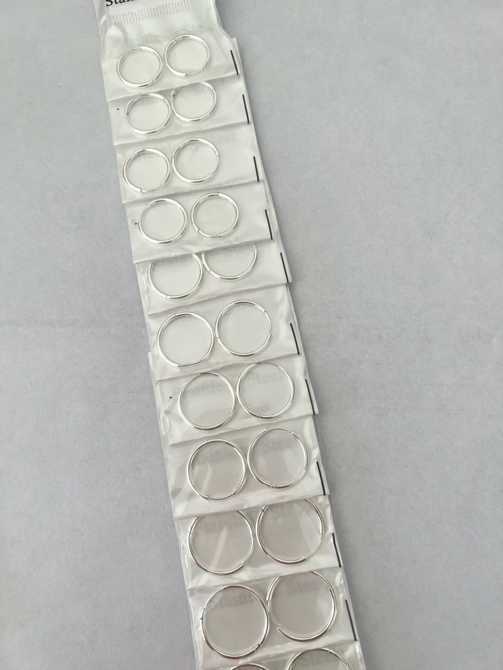 Aritos de acero blanco x12 409-1-C2