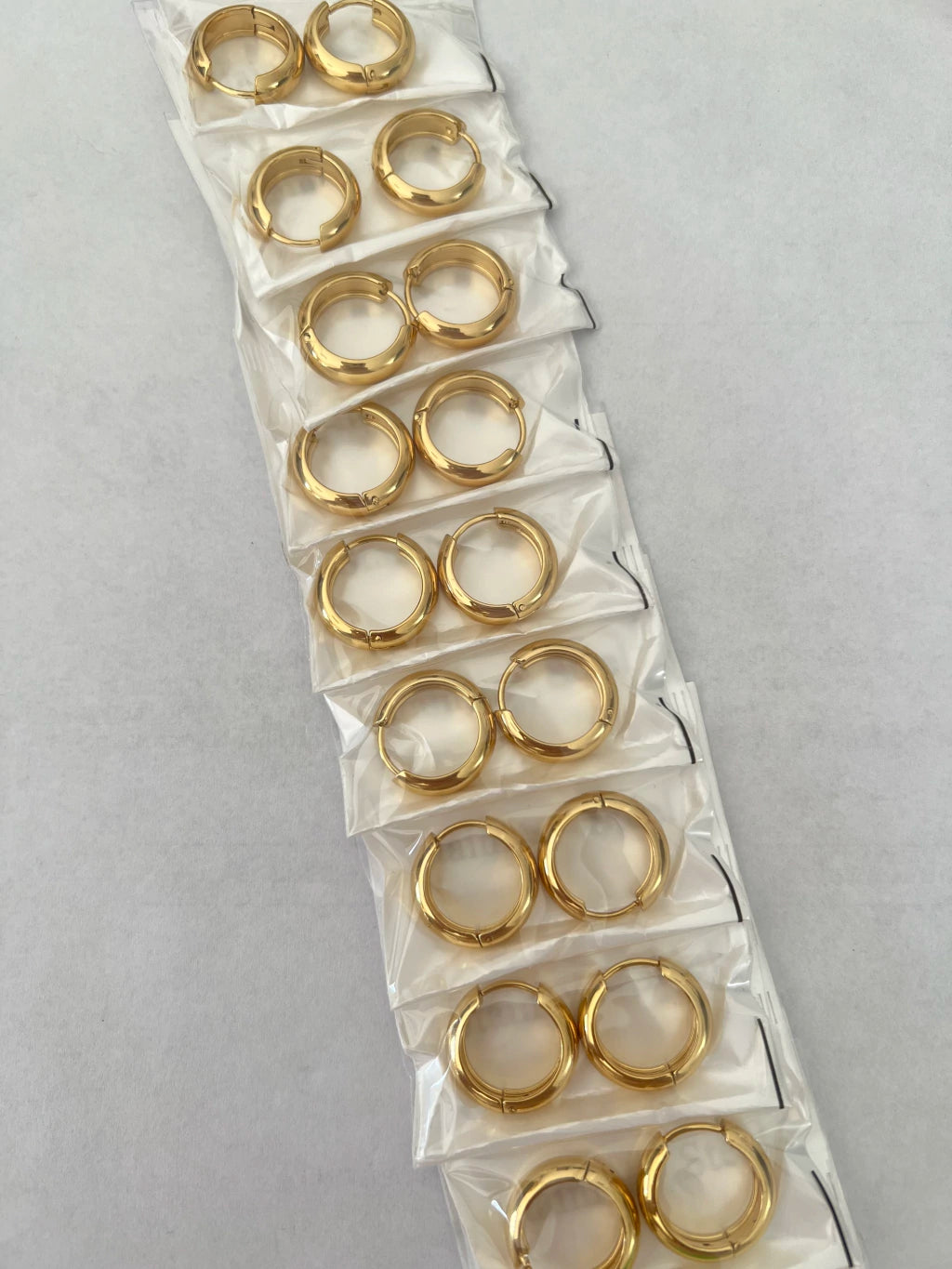 Aritos de acero dorado x12 416-B3
