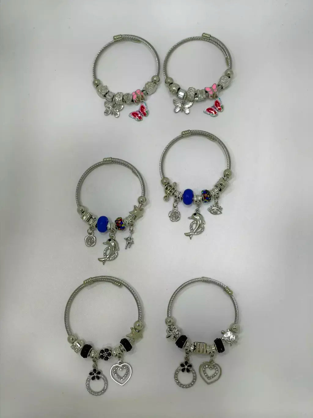 Pulsera con charms al azar en acero