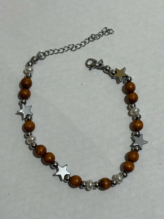 Pulsera elastizado de acero plateado con dije